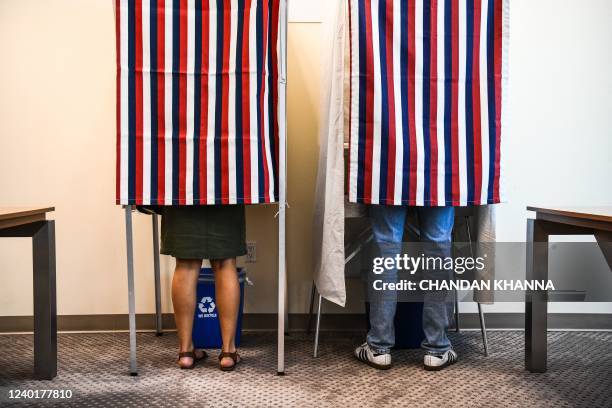 People vote in the second round of the French Elections at the French Consulate in Miami, Florida, on April 23, 2022. - France on Saturday prepared...
