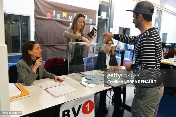 Voters cast their ballots in the second round of the French Elections at the French Consulate in New York, on April 23, 2022. - France on Saturday...