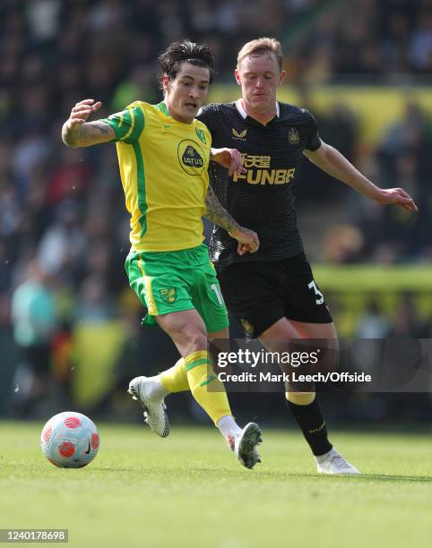 Mathias Normann of Norwich City shields the ball from Sean Longstaff of Newcastle United during the Premier League match between Norwich City and...