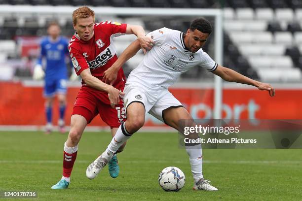 Ben Cabango of Swansea City challenged by Duncan Watmore of Middlesbrough during the Sky Bet Championship match between Swansea City and...