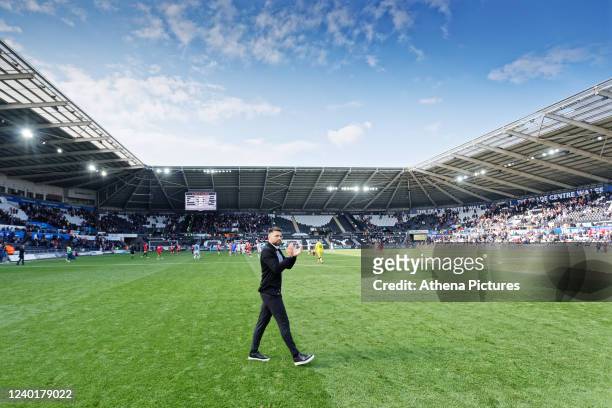 Swansea City manager Russell Martin thanks home supporters after the final whistle during the Sky Bet Championship match between Swansea City and...