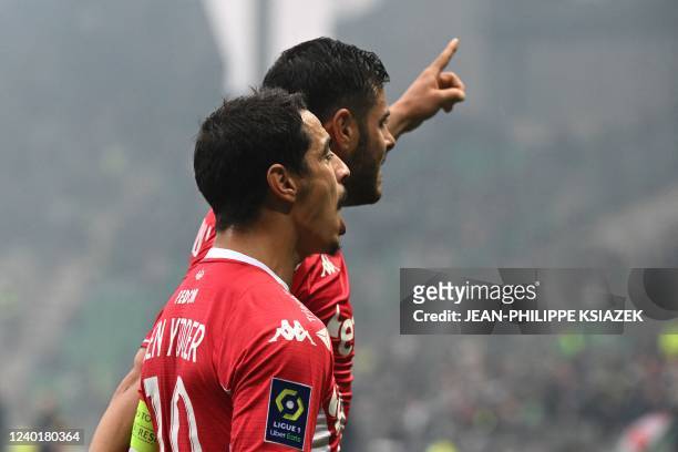 Monaco's French forward Wissam Ben Yedder celebrates with Monaco's German forward Kevin Volland after scoring his team's first goal during the French...