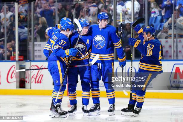 Rasmus Dahlin of the Buffalo Sabres celebrates his second period goal with teammates during an NHL game against the New York Islanders at KeyBank...
