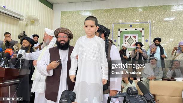Year-old Turkmen boy named Abdulrauf, who was kidnapped 2 years ago in the city of Mazar-i-Sharif in northern Afghanistan, is seen during a ceremony...