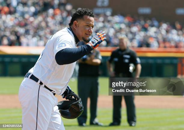 Miguel Cabrera of the Detroit Tigers acknowledges the visiting Colorado Rockies as he heads back to first base with 3,000 hits during the first...