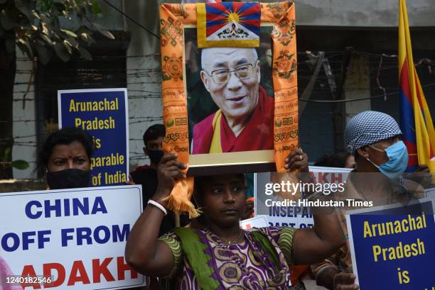 Supporters of the Dalai Lama seen with his portrait, posters, flags of Tibet and India, as they participate in a sit-in protest against China on...