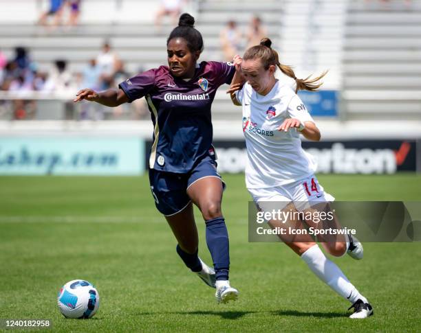 North Carolina Courage midfielder Brianna Pinto and Washington Spirit defender Morgan Goff jockey for the ball during an NWSL Challenge Cup match...
