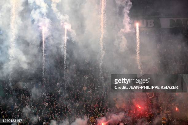 S supporters light flares and let off fireworks during the French L1 football match between Saint-Etienne and AS Monaco at The Geoffroy Guichard...