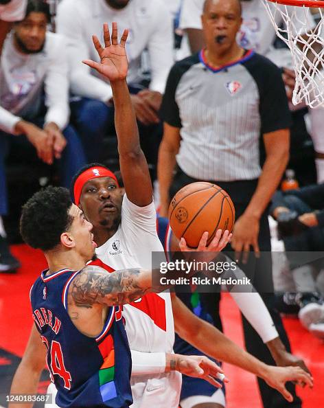 Toronto Raptors forward Chris Boucher defends against Philadelphia ...