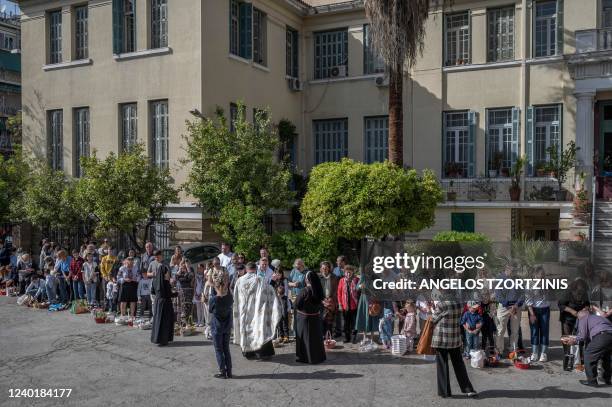 Christians Orthodox worshippers from Ukraine, some of whom live in Greece and others who arrived as refugees, celebrate the Orthodox Easter ceremony...