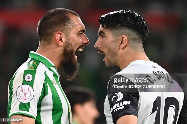 Real Betis' Spanish forward Borja Iglesias argues with Valencia's Spanish midfielder Carlos Soler during the Spanish Copa del Rey final football...