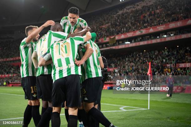 Real Betis' players celebrate their opening goal scored by Spanish forward Borja Iglesias celebrates scoring the opening goal during the Spanish Copa...