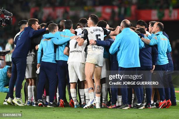 Valencia's players gather prior to playing extra time during the Spanish Copa del Rey final football match between Real Betis and Valencia CF at La...