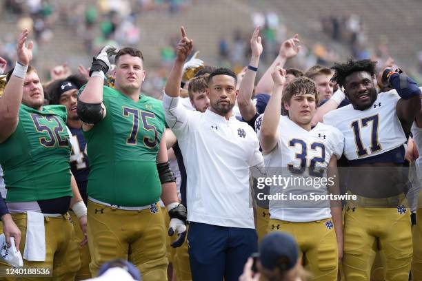 Notre Dame Fighting Irish head coach Marcus Freeman celebrates with players after the Notre Dame Blue-Gold Spring Football Game on April 23, 2022 at...