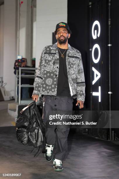 Kyrie Irving of the Brooklyn Nets arrives to the arena before the game against the Boston Celtics during Round 1 Game 3 of the 2022 NBA Playoffs on...