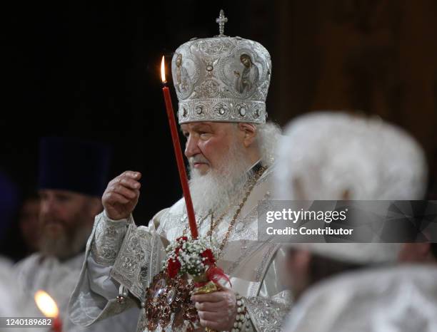 Russian Orthodox Patriarch Kirill does the sign of the cross during the Easter Mass at the Christ The Saviour Cathedral on April 24, 2022 in Moscow,...