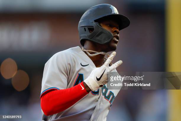 Jazz Chisholm Jr. #2 of the Miami Marlins reacts after hitting a lead off home run during the first inning of an MLB game against the Atlanta Braves...