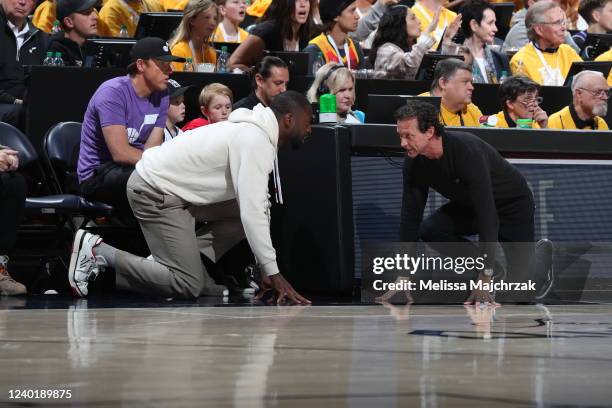 Head Coach Quin Snyder of the Utah Jazz talks with Utah Jazz Owner, Dwyane Wade during Round 1 Game 4 of the 2022 NBA Playoffs against the Dallas...
