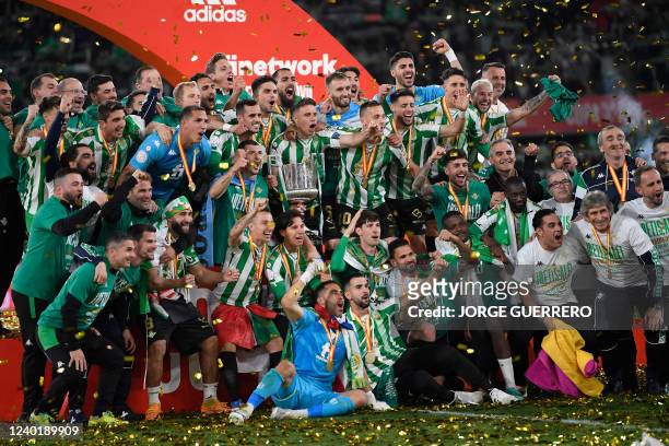 Real Betis' players celebrate their victory after winning the Spanish Copa del Rey final football match between Real Betis and Valencia CF at La...