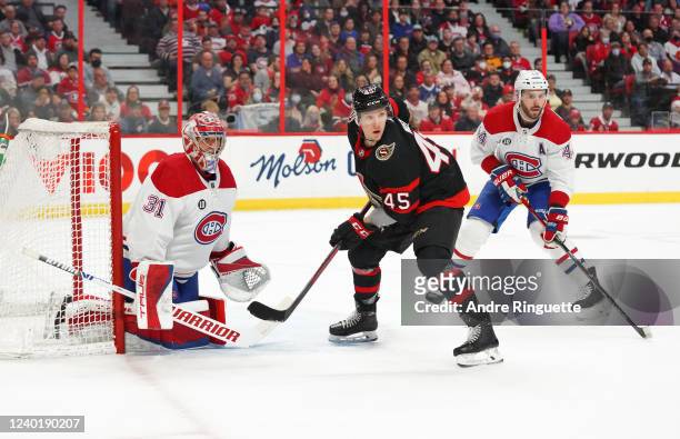 Parker Kelly of the Ottawa Senators goes to the net against Carey Price and Joel Edmundson of the Montreal Canadiens at Canadian Tire Centre on April...