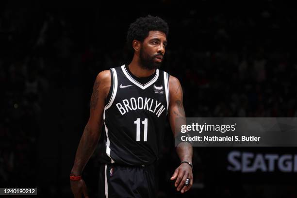 Kyrie Irving of the Brooklyn Nets looks on against the Boston Celtics during Round 1 Game 3 of the 2022 NBA Playoffs on April 23, 2022 at Barclays...