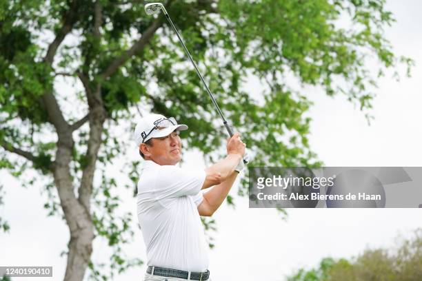 Charlie Wi plays his shot from from the 15th hole tee during round two of the ClubCorp Classic at Las Colinas Country Club on April 23, 2022 in...