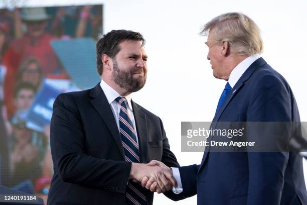 Vance, a Republican candidate for U.S. Senate in Ohio, shakes hands with former President Donald Trump during a rally hosted by the former president...