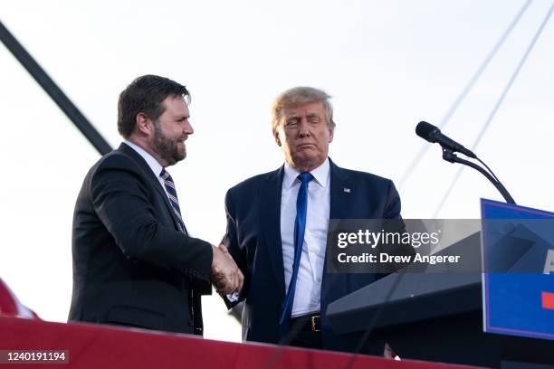 Vance, a Republican candidate for U.S. Senate in Ohio, shakes hands with former President Donald Trump during a rally hosted by the former president...