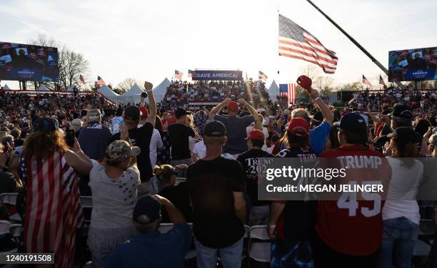 People cheer as former US President Donald Trump speaks during a rally in Delaware, Ohio, on April 23, 2022.