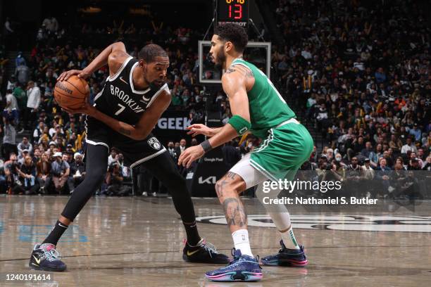 Jayson Tatum of the Boston Celtics plays defense on Kevin Durant of the Brooklyn Nets during Round 1 Game 3 of the 2022 NBA Playoffs on April 23,...