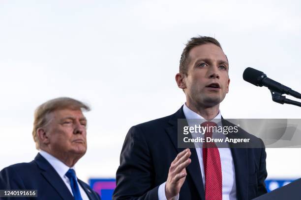 Former U.S. President Donald Trump listens as Max Miller, Republican candidate for Ohio's 7th congressional district, speaks during a rally hosted by...