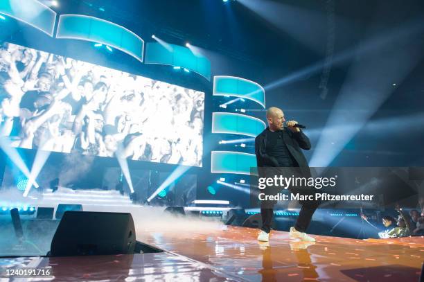 Oli P. Performs live on stage during the 'Schlagernacht des Jahres' at the Lanxess-Arena on April 23, 2022 in Cologne, Germany.