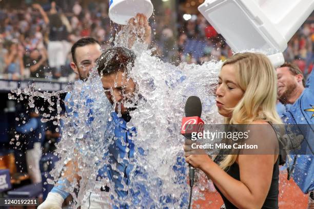 Kevin Kiermaier of the Tampa Bay Rays is doused with water after hitting a game-winning home run against the Boston Red Sox during the 10th inning in...