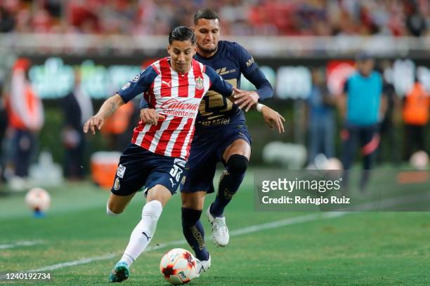 Carlos Cisneros of Chivas fights for the ball with Higor Meritao of Pumas during the 16th round match between Chivas and Pumas UNAM as part of the...