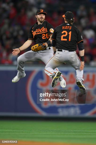 Ryan McKenna of the Baltimore Orioles and Austin Hays celebrate a win over the Los Angeles Angels at Angel Stadium of Anaheim on April 23, 2022 in...