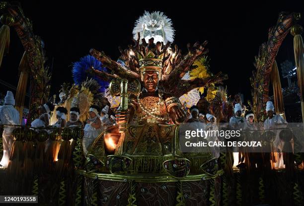 Members of Portela samba school perform on a float during the second night of Rio's Carnival parade at the Sambodrome Marques de Sapucai in Rio de...
