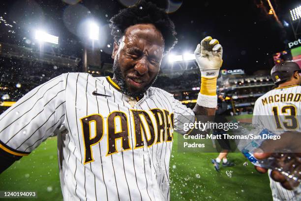 Jurickson Profar of the San Diego Padres is doused with water while celebrating after defeating the Los Angeles Dodgers on a walk-off run on April...