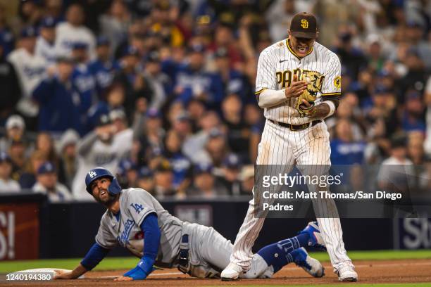 Manny Machado of the San Diego Padres celebrates after tagging out Chris Taylor of the the Los Angeles Dodgers in the ninth inning on April 23, 2022...