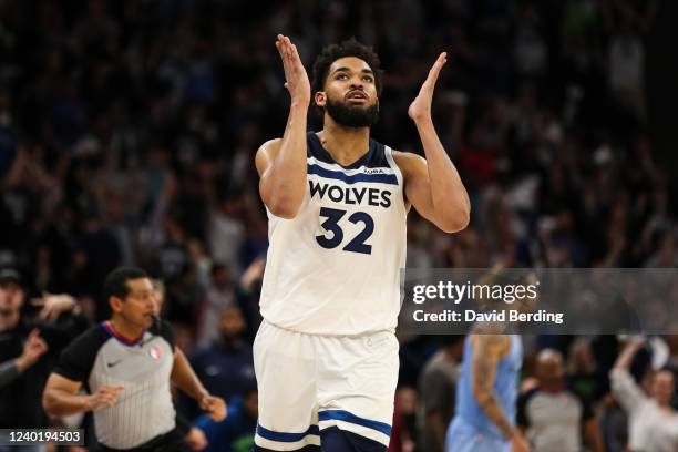 Karl-Anthony Towns of the Minnesota Timberwolves celebrates his three-point basket against the Memphis Grizzlies in the fourth quarter of the game...