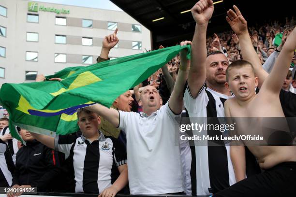 Newcastle United supporters holding Brazilian flags during the Premier League match between Norwich City and Newcastle United at Carrow Road on April...