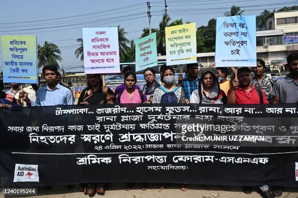 Activists and relatives of victims of the Rana Plaza building collapse take part in a protest to mark the ninth anniversary of the disaster near the...