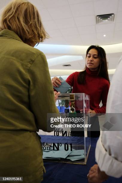 Voter casts her ballot for the second round of France's Presidential Election, at a polling station in Noumea, New Caledonia on April 24, 2022.