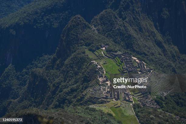 View of the ancient Inca city of Machu Picchu located in the Andes at an altitude of 2,430 meters seen from the top of Machu Picchu mountain. The...