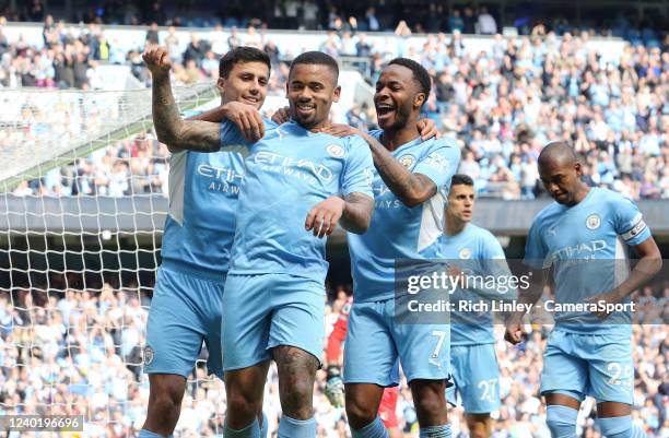 Manchester City's Gabriel Jesus is mobbed by team-mates as he celebrates scoring his sides fourth goal from the penalty spot during the Premier...