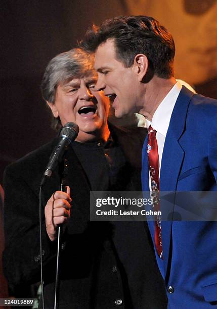 Singers Phil Everly and Chris Isaak perform onstage during a concert in celebration of Buddy Holly's music and legacy held at The Music Box Theatre...