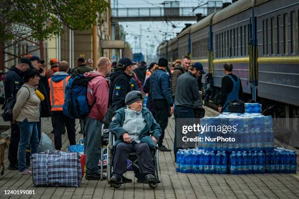 Woman in wheelchair waits for her evacuation to Dnipro city in the Pokrovsk train station. Many civilians from Donbass area are evacuated to safe...