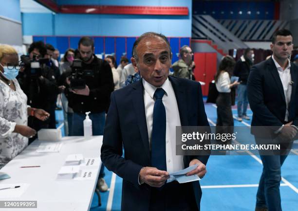 French far-right Reconquete! party President and former presidential candidate Eric Zemmour holds ballots during the second round of France's...