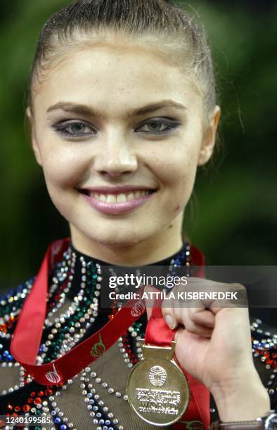 Russian megastar of rhythmical gymnastic Alina Kabaeva presents her gold medal of individual competition in 'Budapest Arena' , 27 September 2003...