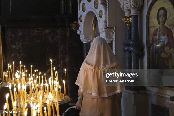 People attend an Orthodox Easter service at the St. Volodymyr's Cathedral in Kyiv, Ukraine on April 23, 2022. Holy Saturday is the day before Easter...