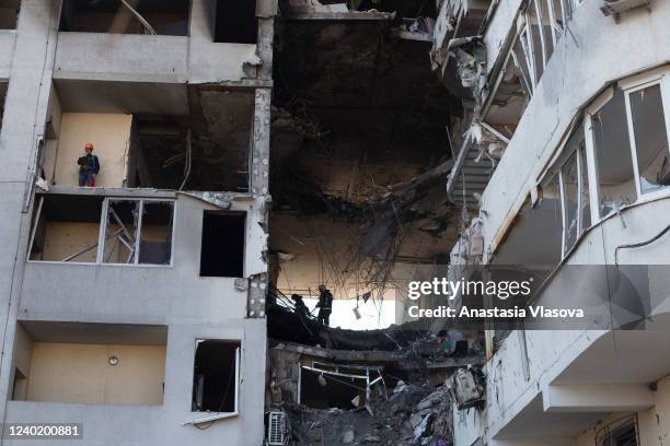 Rescue workers remove rubble from a residential building which was hit by a rocket the previous day on April 24, 2022 in Odessa, Ukraine. Ukrainian...